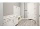 Well-organized mudroom with built-in storage, bench, and coat hooks for convenient entryway solutions at 25339 N 19Th Ln, Phoenix, AZ 85085