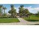 Community park featuring a walking path, picnic tables, and lush green space at 25339 N 19Th Ln, Phoenix, AZ 85085