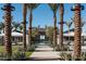 Community pool area with palm trees, lush landscaping, and inviting cabanas for relaxing by the pool at 25339 N 19Th Ln, Phoenix, AZ 85085