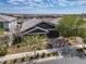 A beautiful single-Gathering home features professional landscaping and a cozy, covered front porch at 25511 S 227Th St, Queen Creek, AZ 85142