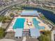 Bird's eye view of a community pool, lake, and clubhouse with seating and shade at 25511 S 227Th St, Queen Creek, AZ 85142