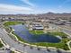 Expansive aerial view of the community lake, playground, and surrounding homes at 25511 S 227Th St, Queen Creek, AZ 85142