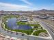 Community aerial featuring a lake, park, pool and an immense neighborhood at 25511 S 227Th St, Queen Creek, AZ 85142