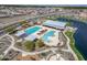 Stunning aerial view of the community pool, lake, and recreation center at 25511 S 227Th St, Queen Creek, AZ 85142