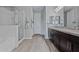 Bathroom featuring a large shower, dark cabinetry, and tiled floors for a modern touch at 25511 S 227Th St, Queen Creek, AZ 85142