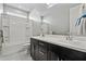 Bathroom featuring a double sink vanity and a tub with shower at 25511 S 227Th St, Queen Creek, AZ 85142
