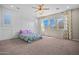 Spacious bedroom with carpet and board and batten wall, offering comfort and style at 25511 S 227Th St, Queen Creek, AZ 85142