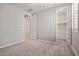A bedroom with carpet, neutral walls, and a walk-in closet at 25511 S 227Th St, Queen Creek, AZ 85142