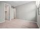 A bedroom with carpet, light-colored walls, and a walk-in closet at 25511 S 227Th St, Queen Creek, AZ 85142