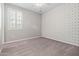 A room with wallpaper, carpet, and a window providing natural light at 25511 S 227Th St, Queen Creek, AZ 85142
