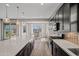 Spacious kitchen with large island, stainless steel appliances, and an adjacent dining area with ample natural light at 25511 S 227Th St, Queen Creek, AZ 85142