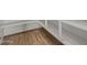 Walk-in pantry features wood-look tile floors and white shelving at 25511 S 227Th St, Queen Creek, AZ 85142