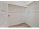 A walk-in closet with wooden racks for storing clothes at 25511 S 227Th St, Queen Creek, AZ 85142