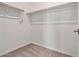 A walk-in closet with wooden rods for storing clothes at 25511 S 227Th St, Queen Creek, AZ 85142
