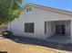 Backyard with grass, trees, block fence and patio at 25798 W Miami St, Buckeye, AZ 85326