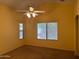 Bright bedroom with ceiling fan and ample natural light at 25798 W Miami St, Buckeye, AZ 85326