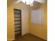 Bedroom with a closet and shelves, carpet, and window at 25798 W Miami St, Buckeye, AZ 85326