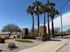 Community entrance showcasing desert landscaping, towering palm trees, and the Westpark community sign at 25798 W Miami St, Buckeye, AZ 85326