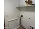 Bright laundry area offering convenient shelving and utility connections at 25798 W Miami St, Buckeye, AZ 85326