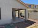 View of the covered back patio of a home with desert landscaping and block wall at 25798 W Miami St, Buckeye, AZ 85326