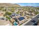Neighborhood aerial view showcasing homes with solar panels and a backyard with a pool at 27204 N 86Th Dr, Peoria, AZ 85383