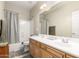 Functional bathroom with a double sink vanity, shower-tub combo, and neutral finishes at 27204 N 86Th Dr, Peoria, AZ 85383