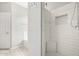 Clean and modern shower with a built-in bench and niche, and a separate tub area at 27204 N 86Th Dr, Peoria, AZ 85383