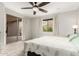 Bright bedroom with a sliding glass door to the patio and a large window at 27204 N 86Th Dr, Peoria, AZ 85383