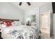 Comfortable bedroom with mirrored closets and a ceiling fan, bathed in soft, natural light at 27204 N 86Th Dr, Peoria, AZ 85383