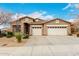 Charming home featuring a three-car garage, desert landscaping, and a tile roof at 27204 N 86Th Dr, Peoria, AZ 85383