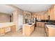 Well-lit kitchen with island, stainless steel appliances, plenty of cabinet space, and modern fixtures at 27204 N 86Th Dr, Peoria, AZ 85383