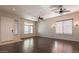Bright living room with hardwood floors, generous windows, and neutral walls at 27204 N 86Th Dr, Peoria, AZ 85383