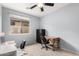 Functional home office with natural lighting, desk and storage solutions, ideal for productivity at 27204 N 86Th Dr, Peoria, AZ 85383