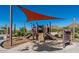 Playground featuring slides and climbing structures shaded by a canopy at 27204 N 86Th Dr, Peoria, AZ 85383
