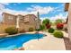 Inviting private pool with rock accents, patio space, and lush landscaping for outdoor enjoyment at 27204 N 86Th Dr, Peoria, AZ 85383