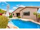 Inviting private pool with rock accents, patio space, and lush landscaping for outdoor enjoyment at 27204 N 86Th Dr, Peoria, AZ 85383