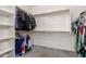 Organized walk-in closet with ample shelving and hanging space for clothes and storage at 27204 N 86Th Dr, Peoria, AZ 85383