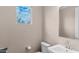 Powder room featuring a modern sink, a window and a large mirror at 2855 E Tina Dr, Phoenix, AZ 85050