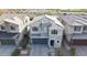 A modern two-story home with a stone facade, well-manicured landscaping, and a two-car garage at 2855 E Tina Dr, Phoenix, AZ 85050