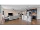 Bright open-concept living space with modern furniture and a kitchen island with bar seating at 2855 E Tina Dr, Phoenix, AZ 85050