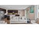 Open-concept living area with a spacious kitchen and comfortable seating arrangements at 2855 E Tina Dr, Phoenix, AZ 85050