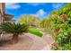 Beautiful backyard with manicured landscaping and stone pathway at 2878 E Tonto Dr, Gilbert, AZ 85298