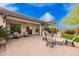 Back patio with pergola, plush seating, and manicured landscaping at 2878 E Tonto Dr, Gilbert, AZ 85298