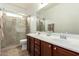 Bathroom with walk-in shower and double sink vanity at 2878 E Tonto Dr, Gilbert, AZ 85298