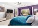 Comfortable bedroom featuring a backyard view, walkout access, and a ceiling fan at 2878 E Tonto Dr, Gilbert, AZ 85298