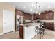 Modern kitchen featuring stainless steel appliances, a breakfast bar, and beautiful cabinetry at 2878 E Tonto Dr, Gilbert, AZ 85298