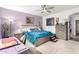 Serene main bedroom featuring soft lighting, a ceiling fan, and a comfortable king-size bed at 2878 E Tonto Dr, Gilbert, AZ 85298