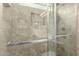 Shower with a glass door and decorative tile at 2878 E Tonto Dr, Gilbert, AZ 85298