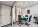 Bright dining area with modern decor, grey painted brick, and natural light at 3002 N 32Nd St # 13, Phoenix, AZ 85018