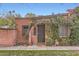 Quaint brick home featuring a vine-covered arched entryway and a landscaped yard at 3002 N 32Nd St # 13, Phoenix, AZ 85018